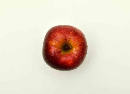 Red apples on a light background. Juicy fruits.の写真素材