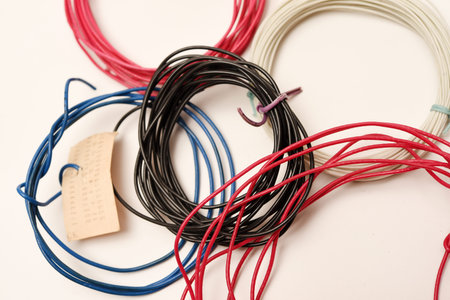 Coils of multicolored wires for electronics. Wires for devices.
