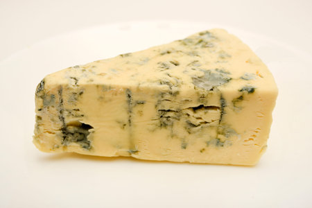 Cheese with blue mold. Pieces of cheese with mold.