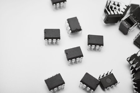 A group of chips on a white background. Computer chips. Components of semiconductor devices.