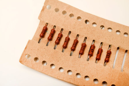 Brown resistor in a paper package. The electronic component.