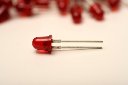 A red LED on the background of a pile of LED elements. One LED.の写真素材