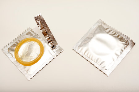 An open condom in a package. Male contraceptives.の写真素材