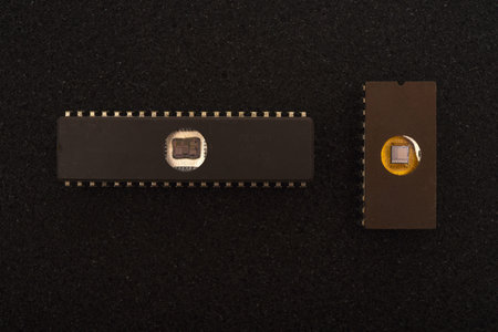 Several microchips on black foam. Old integrated circuits for radio electronics.