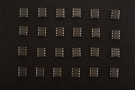 Microcircuits on black foam. Multiple chips on a substrate.