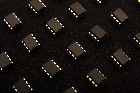 Microcircuits on black foam. Multiple chips on a substrate.