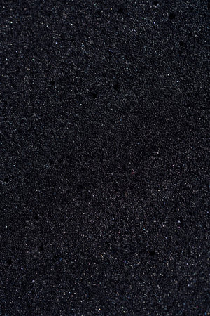 Background of porous foam rubber. Black foam rubber.の写真素材