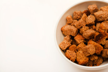 Spicy and salty crackers in cups. Bread snacks.の写真素材