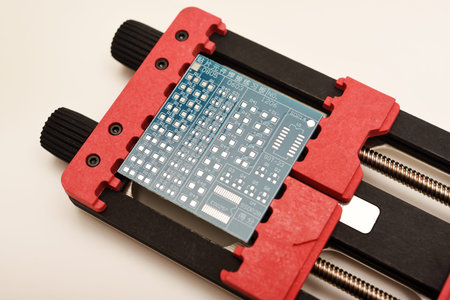 Universal professional holder for circuit boards and microchips. Blue printed circuit board for...