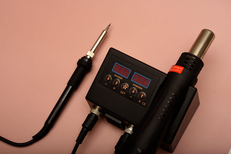 Black soldering station with hairdryer and soldering iron.の写真素材