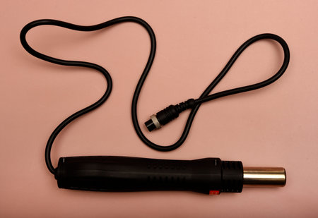 Black soldering iron. Soldering iron for mounting radio elements.の写真素材