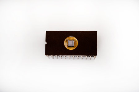 The microcircuit. An old microcircuit on a white background. An electronic device.