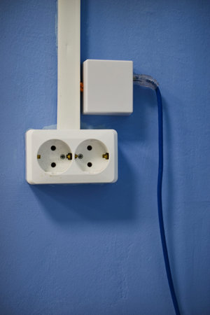 Sockets on the wall in the office. An electrical outlet in the house.