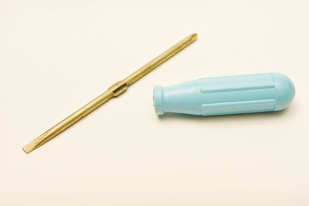 A light blue screwdriver on a white background. A hand tool.の写真素材