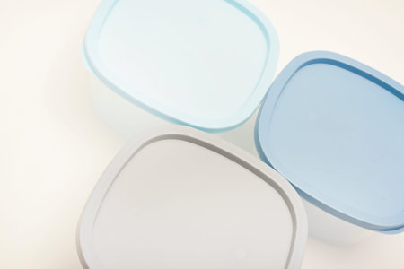 Large containers for food. Three plastic containers with a blue lid for food on a white background.