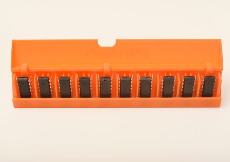Microchips in a plastic case. Integrated circuits in a plastic storage case. Electronic chips.