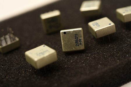 Old chips on a black background. Microchips on foam rubber. Microcircuits.