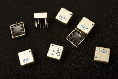 Old chips on a black background. Microchips on foam rubber. Microcircuits.