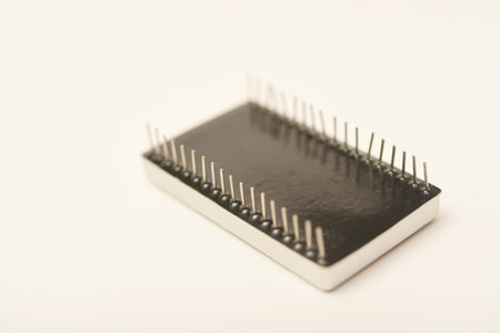 Old chips on a white background. Different electronic chips. Microcircuits in a metal case.