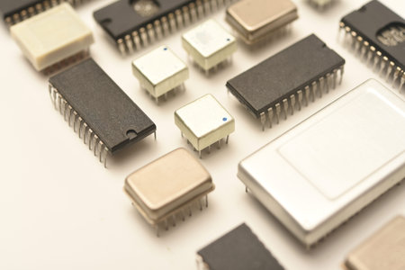 Old chips on a white background. Electronic components. Processors in metal and plastic cases.の写真素材