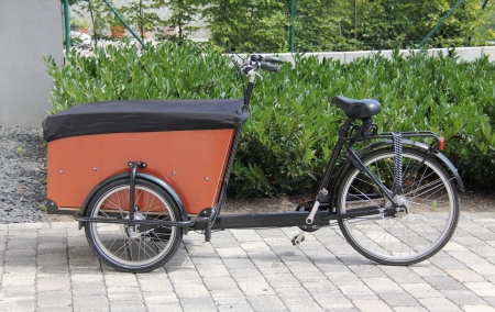 Typical modern carrier bicycle in the city  This vehicle can use for the transport of mail and other small goodsの写真素材