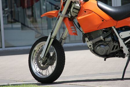 Sport orange motorcycle in the cityの写真素材