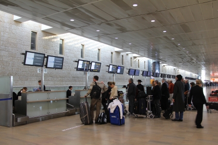 Passengers wait in reception area of tickets and luggage at the airport Ben Gurion Airport   Ð¢erminal number 3 officially opened in 2004 and is one of the busiest airports at Middle East , which meets modern requirements to international airports のeditorial素材