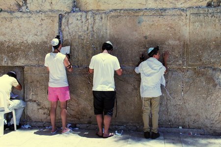 Jewish worshipers praying  at the Wailing Wall an important jewish religious site in Jerusalem,...