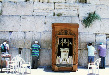 Jewish worshipers praying  at the Wailing Wall an important jewish religious site in Jerusalem, Israelのeditorial素材