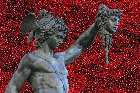detail of  statue of Perseus holding the head of Medusa on white background, Florence, Italy bronze...