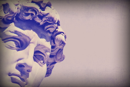 Grunge detail  of Michelangelo's David statue  with the effect of the color purple haze and  place for your design or textの写真素材