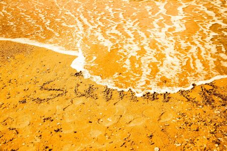 Inscription beach sand Summer. Concept photo of summer travel and vacation.の写真素材