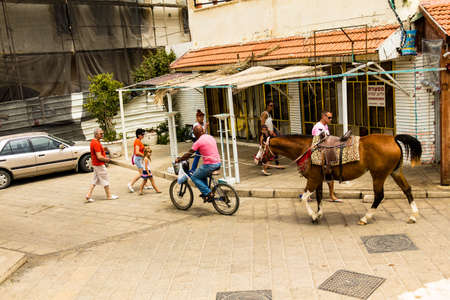 Unidentified tourists and locals in Old medieval Arab neighborhood of Jaffa. Israelのeditorial素材