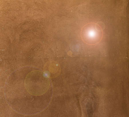 Brown plaster pattern  background with colored hotspot  place for your design or textの写真素材