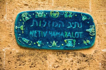 Ceramic plate in Jaffa  with Zodiac signs telling that all the streets are named after zodiac signs. Israelのeditorial素材
