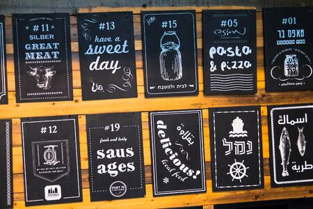 Billboard indicating little restaurants and cafes in Jaffa. Israelのeditorial素材