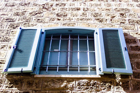 Windows with shuttered  in stone wall of  Old Jaffa. Israelの写真素材