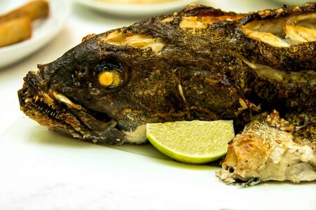 Grouper baked in the oven at the banquet tableの写真素材