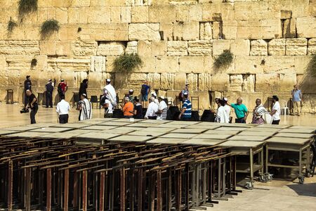 Unidentified Jews spend Bar Mitzvah ceremony near Western Wall. A man carries a 13-year-old boy on his shoulders. Jerusalem. Israelのeditorial素材