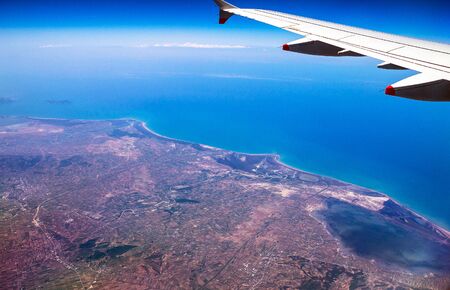 Flight Over Rhodes on deep blue sky background with soft focusの写真素材