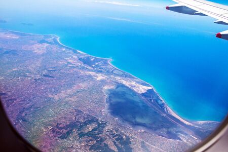 Flight Over Rhodes on deep blue sky background with soft focusの写真素材