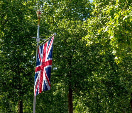 The Union Jack Flag flying from a flag pole on The Mall street. London.  England.  UK.  Taken in...