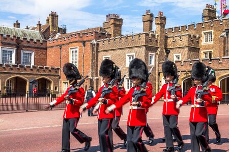 British guardsmen march down opposite St. James Palace. Selective focus. London,UKのeditorial素材
