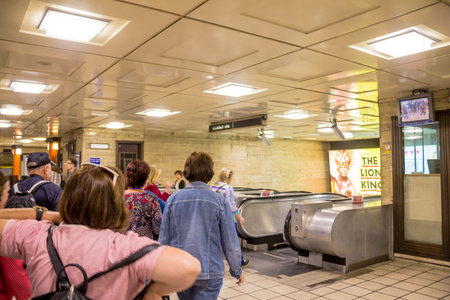 Unidentified people at the  Piccadilly Underground  Station at day time. London, UK.