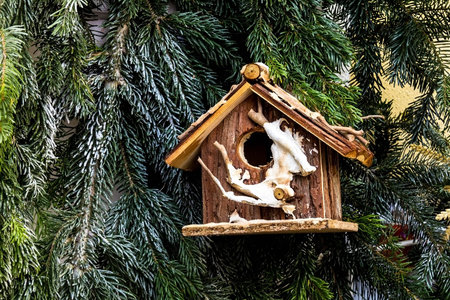 Christmas decoration with wooden  nesting box at the street  near hotel in small german town