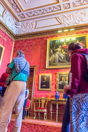 Unidentified visitors inside royal palace in medieval Windsor Castle. Windsor Castle is a royal residence at Windsor in the English county of Berkshire. It was built in 1066 by William the Conqueror and it is the longest-occupied palace in Europe. UKのeditorial素材