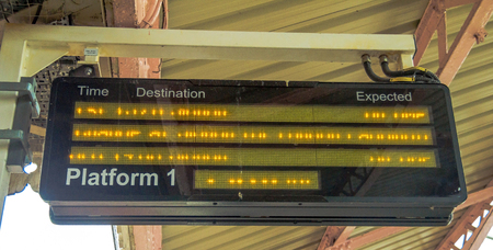 Old electronic scoreboard, giving passengers required information on arrival and departure at the  Windsor train station. UKのeditorial素材