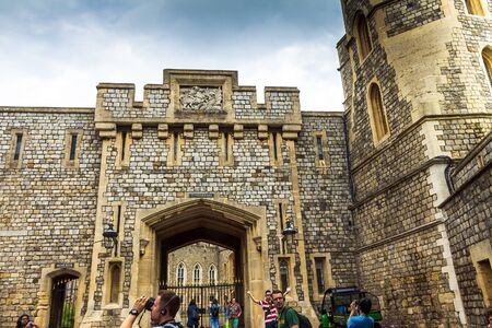 Unidentified visitors near the gate of St. George in the interior of Windsor Castle. Windsor Castle is a royal residence at Windsor in the English county of Berkshire. UKのeditorial素材
