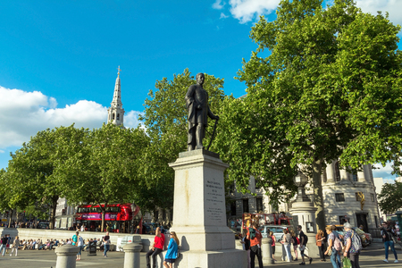 Tourists visit Trafalgar Square  . One of the most popular tourist attraction on Earth it has more than fifteen million visitors a year. London. UKのeditorial素材