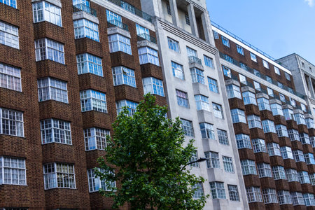Typical English multistory red brick building  in a summer afternoon at Coram street near Russell...
